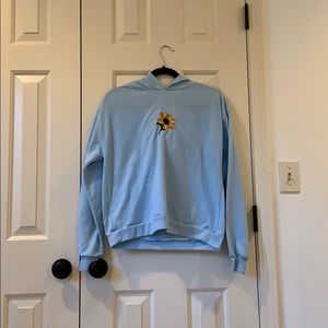Hoodie with sunflower embroidery on it